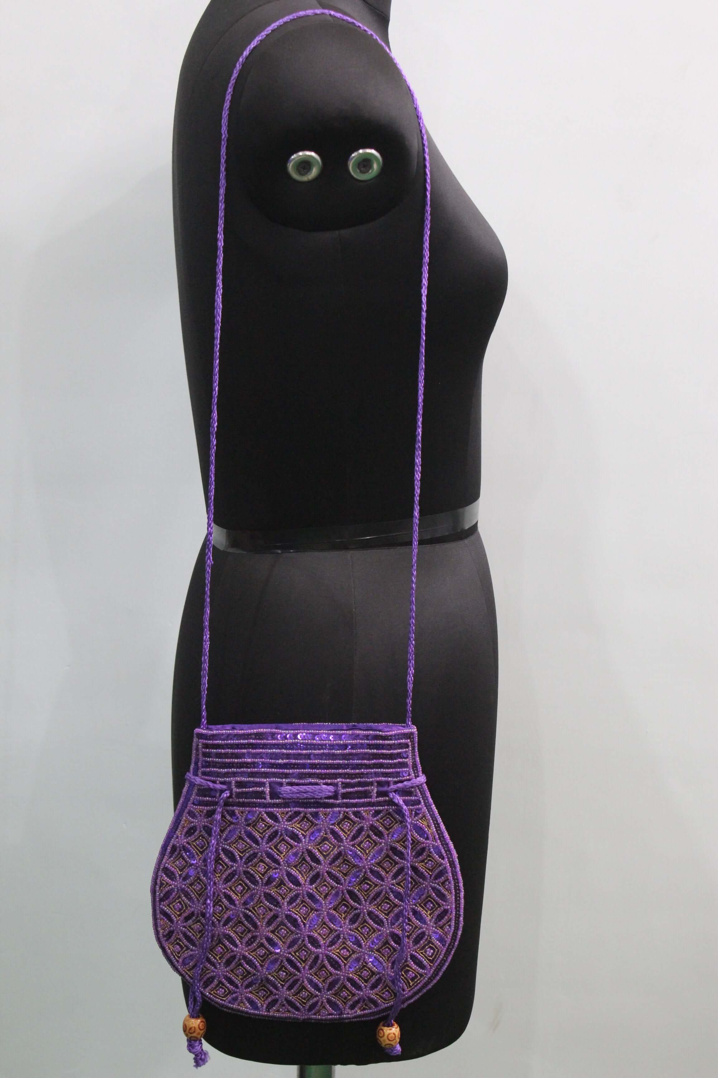Beautiful purple handmade Indian potli bag with sequins, perfect for fashion and carrying small articles.